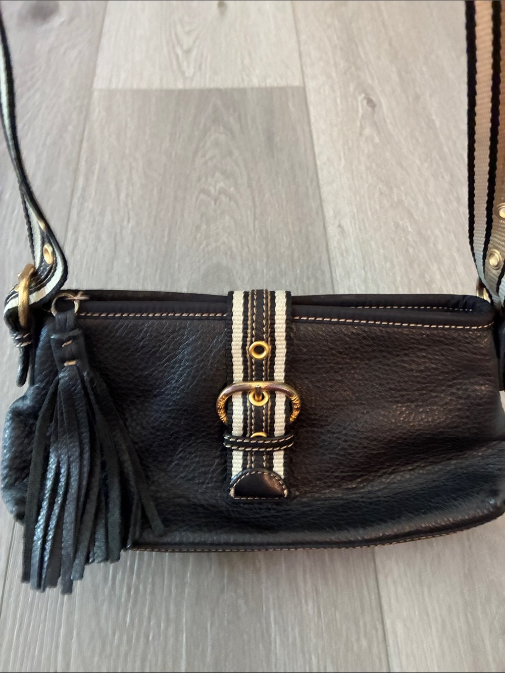 The Sak Black Leather Crossbody with Striped Strap and Tassel